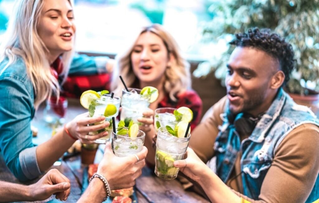 A group of people holding drinks